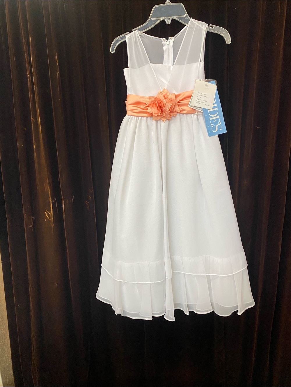 White Girls' Sleeveless Dress with Coral Sash and Floral Accent